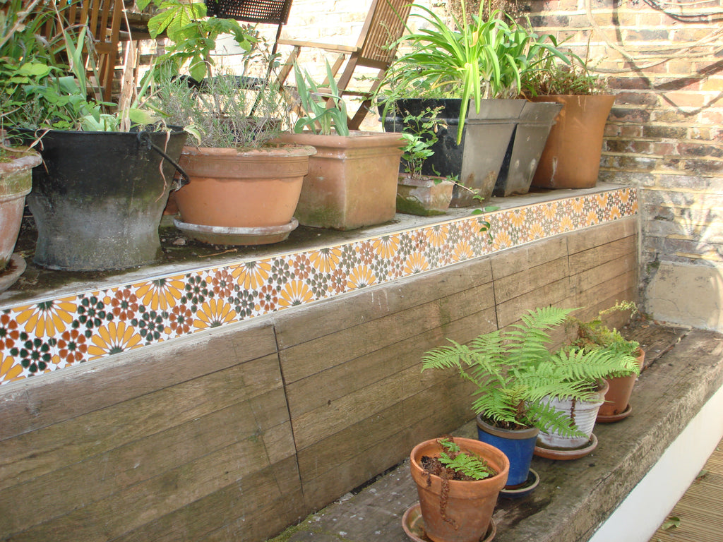Yellow, red, and green Medina tile flower bed border